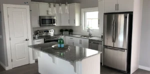 white kitchen with gray counter tops