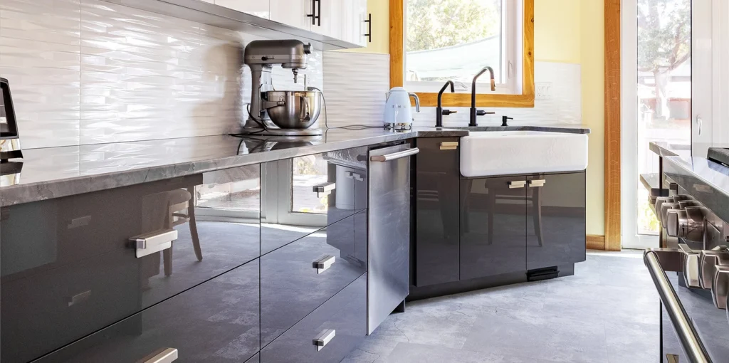 Kitchen design with black cabinets and white counter tops