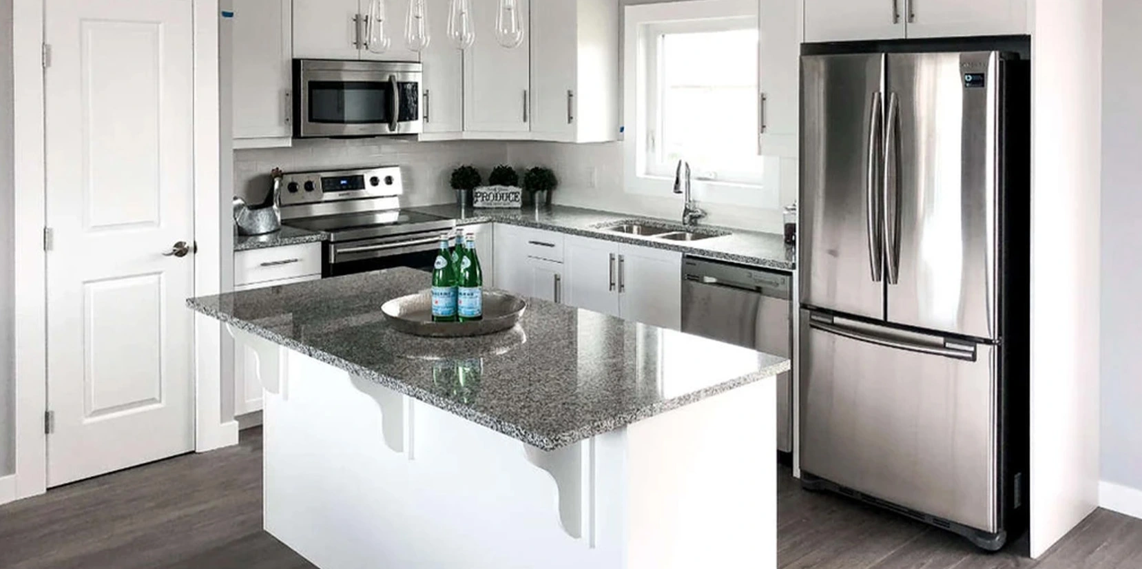 white kitchen with grey granite counter tops