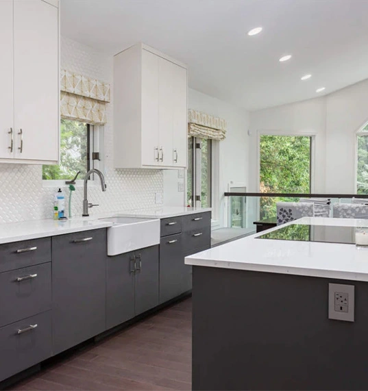 kitchen with charcoal gray cabinets and white counter top