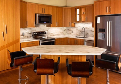kitchen with light brown cabinets and white counter tops